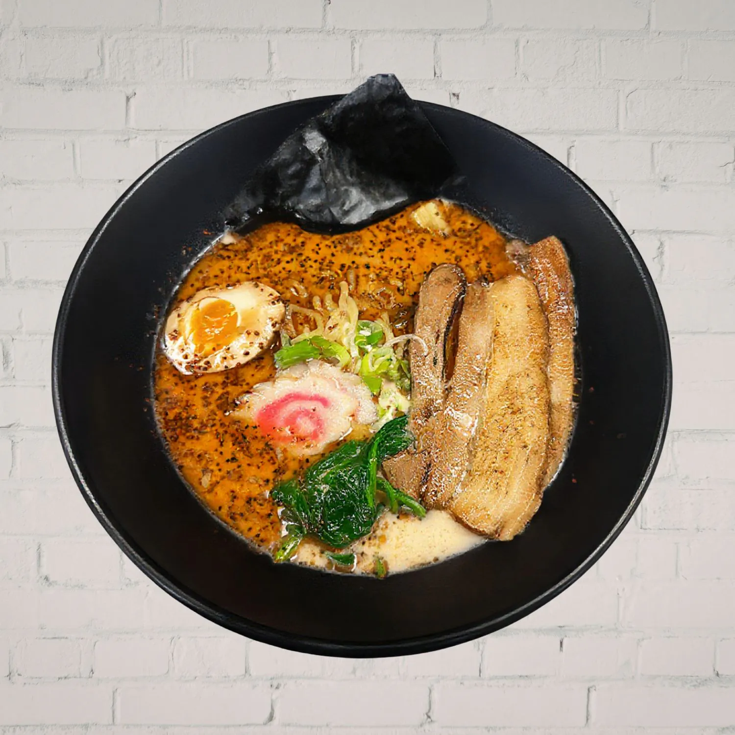 Spicy pork bone ramen with chashu, egg and chili oil at Kaiju Ramen & Curry, a Japanese Curry Restaurant in Isla Vista